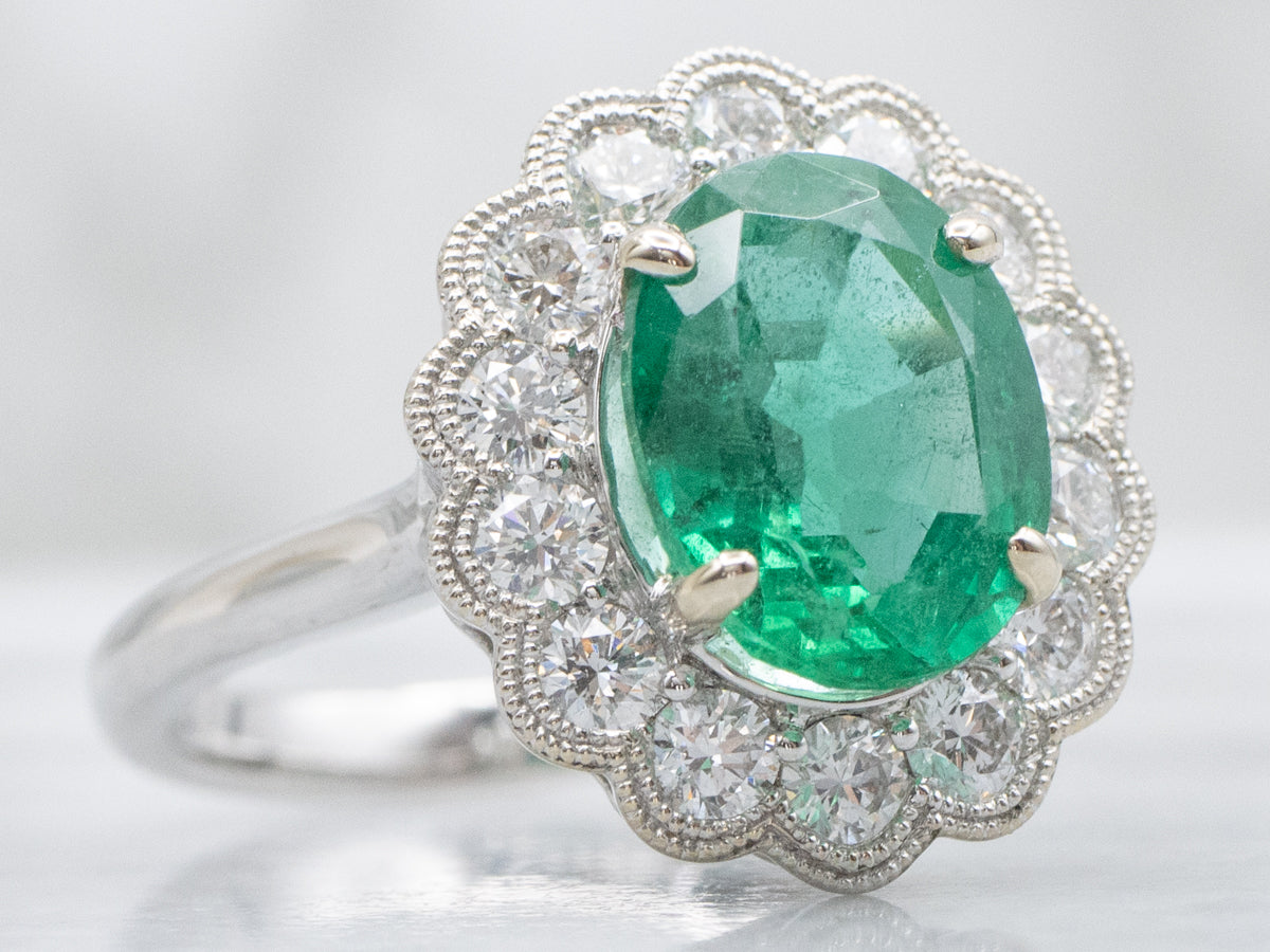 Scallop-Gold Emerald and Diamond Halo Ring
