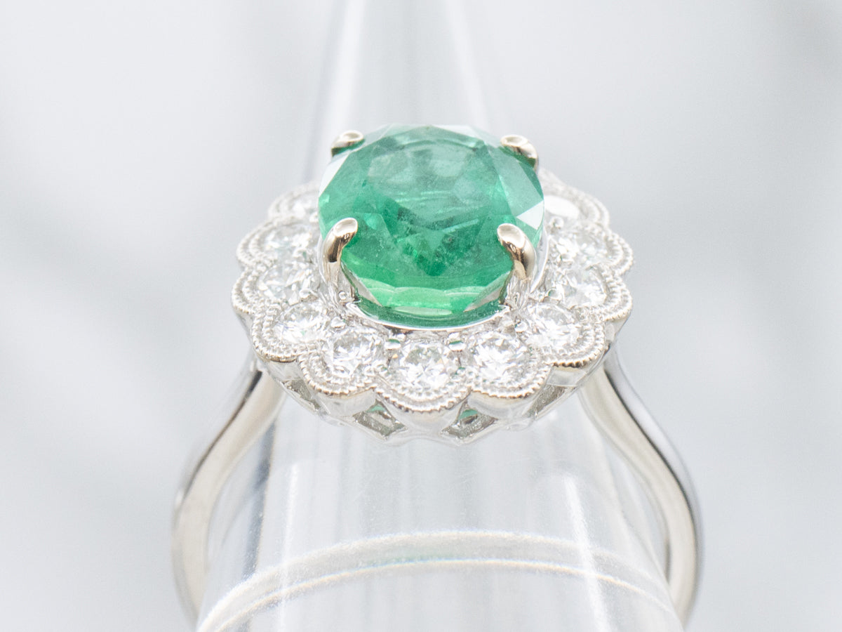 Scallop-Gold Emerald and Diamond Halo Ring