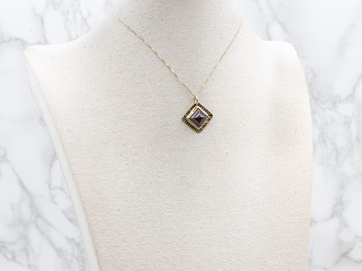 Squared Garnet Cabochon Yellow Gold Pendant