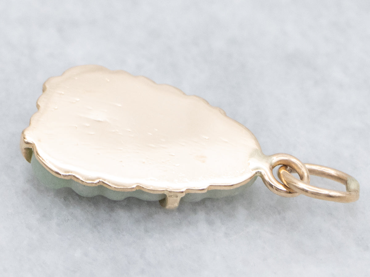 Carved Jadeite Buddha and Gold Pendant