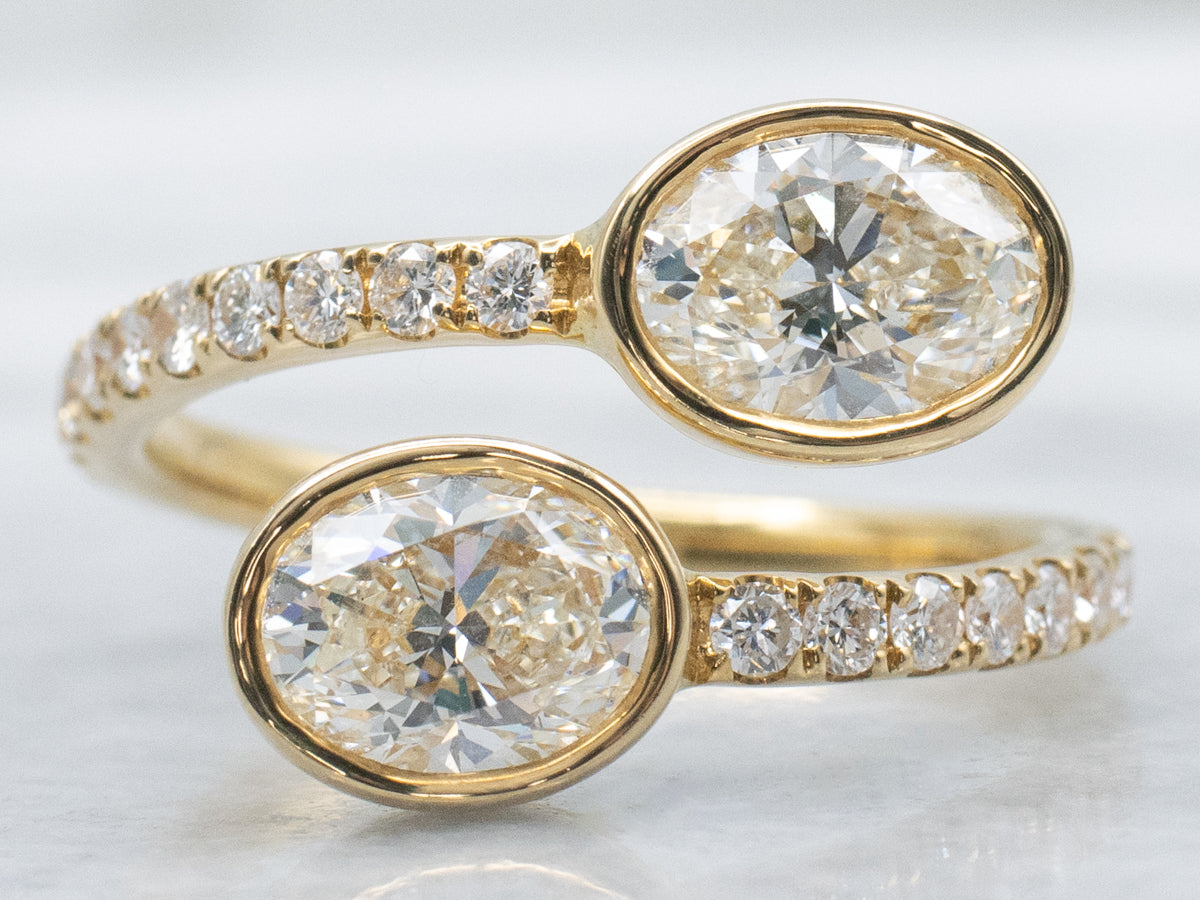Modern 18-Karat Gold Oval-Cut Diamond Bypass Ring