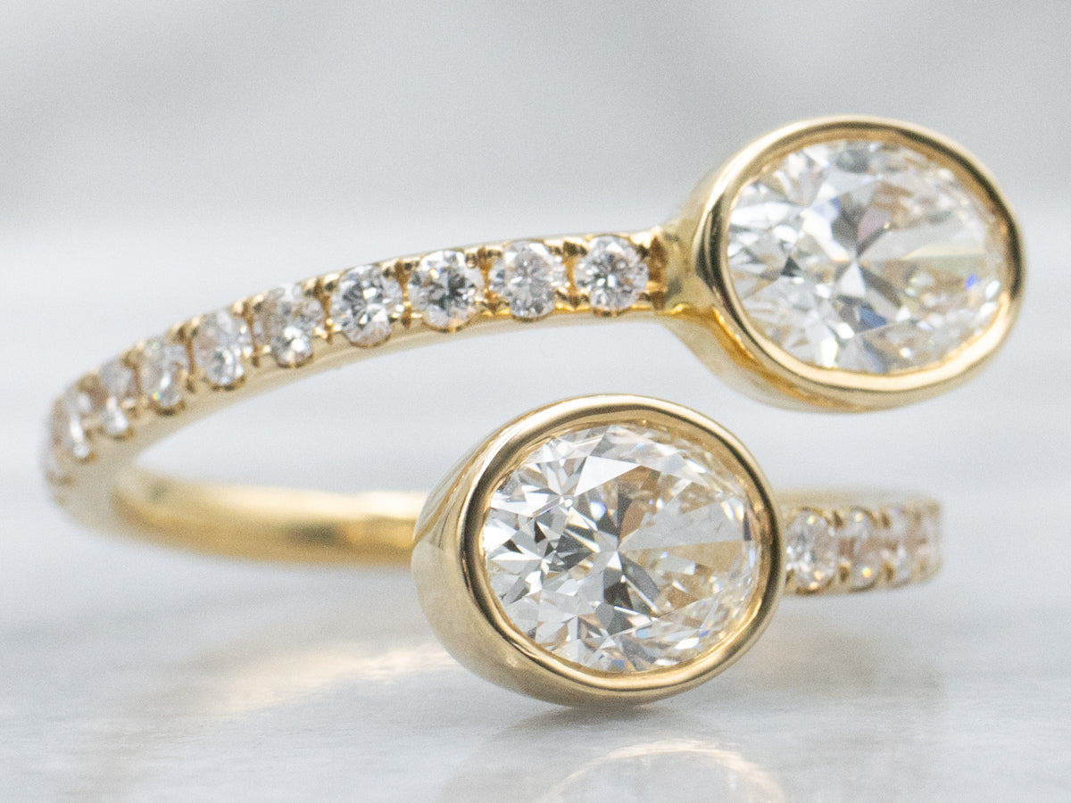 Modern 18-Karat Gold Oval-Cut Diamond Bypass Ring