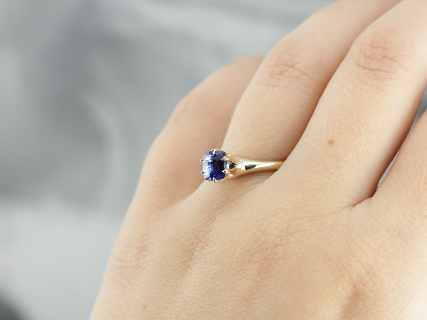 Royal Blue Oval Sapphire surrounded with a halo of Diamonds set in 14k–  Victoria's Jewels - Fine Jewelry in Corpus Christi