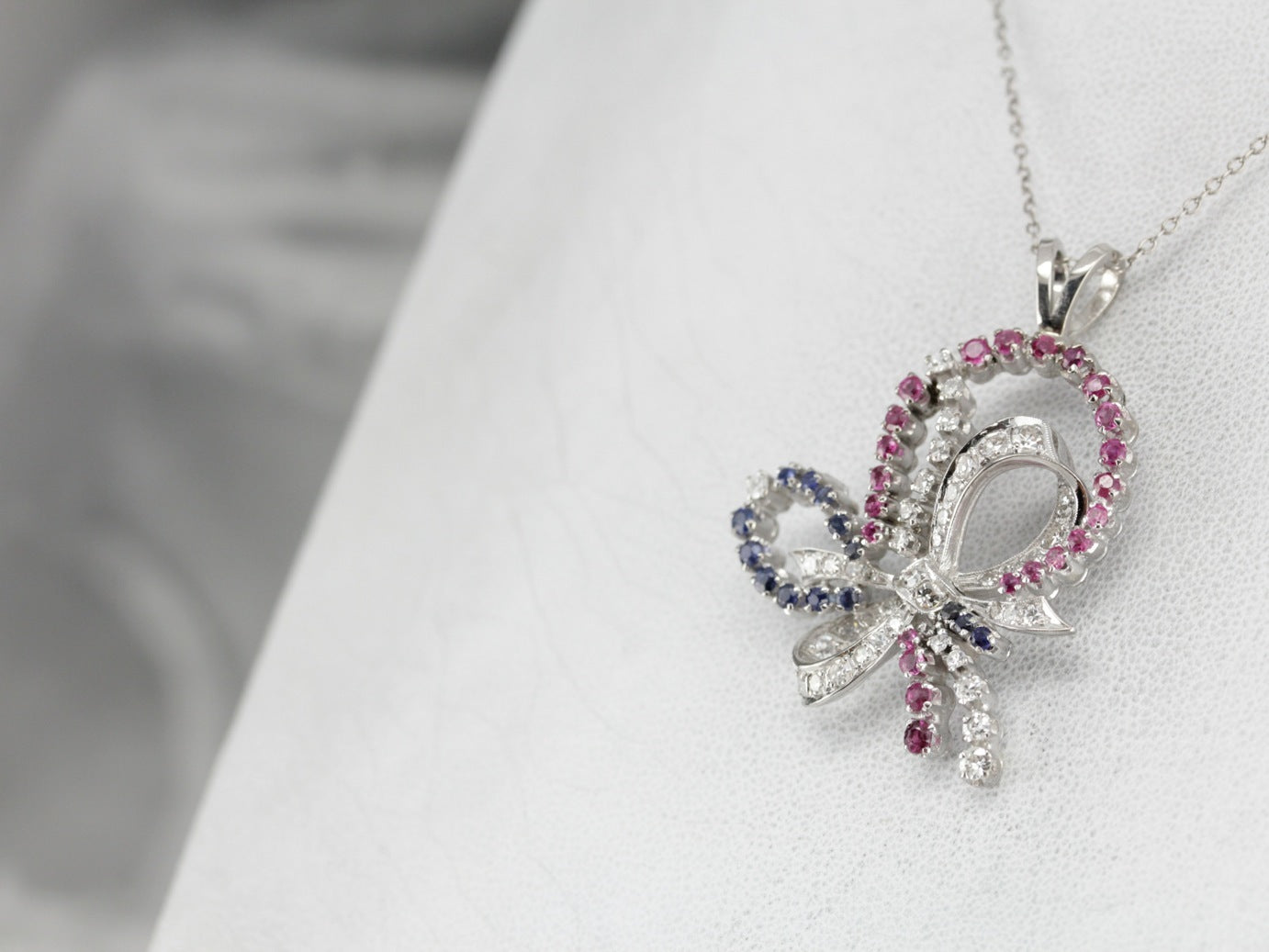 Retro Era Platinum and Diamond Bow Pendant