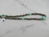 Taupe Colored Antique Beaded Necklace With Green Glass Beads