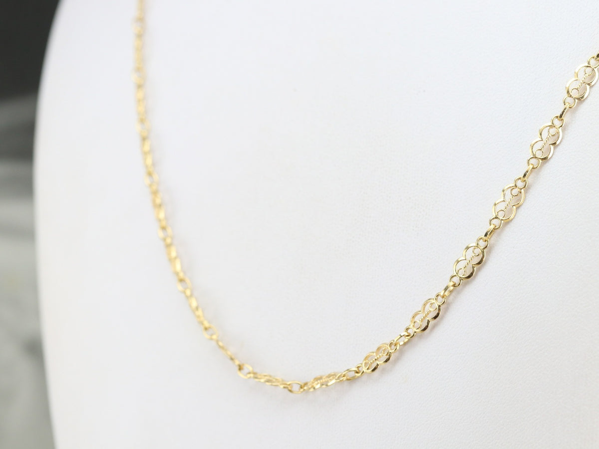 Cadena de eslabones decorativos de oro