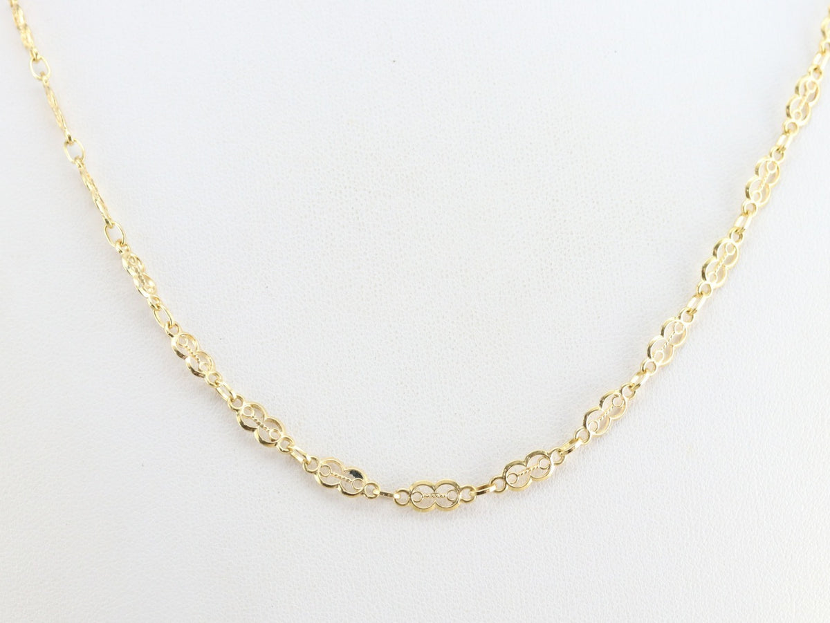 Cadena de eslabones decorativos de oro