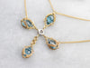 Gold Blue Topaz and Diamond Cross Necklace