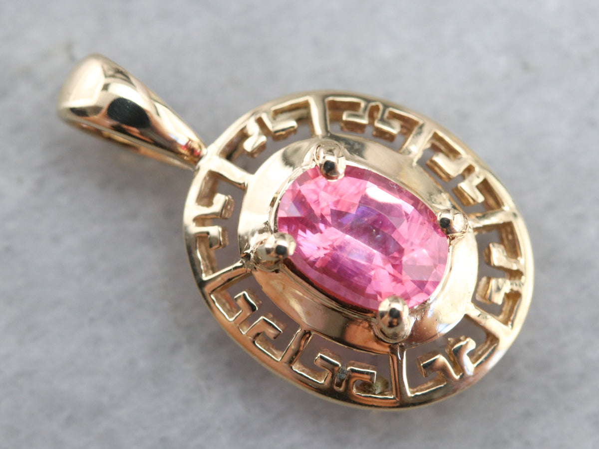Colgante de oro perforado con zafiro rosa