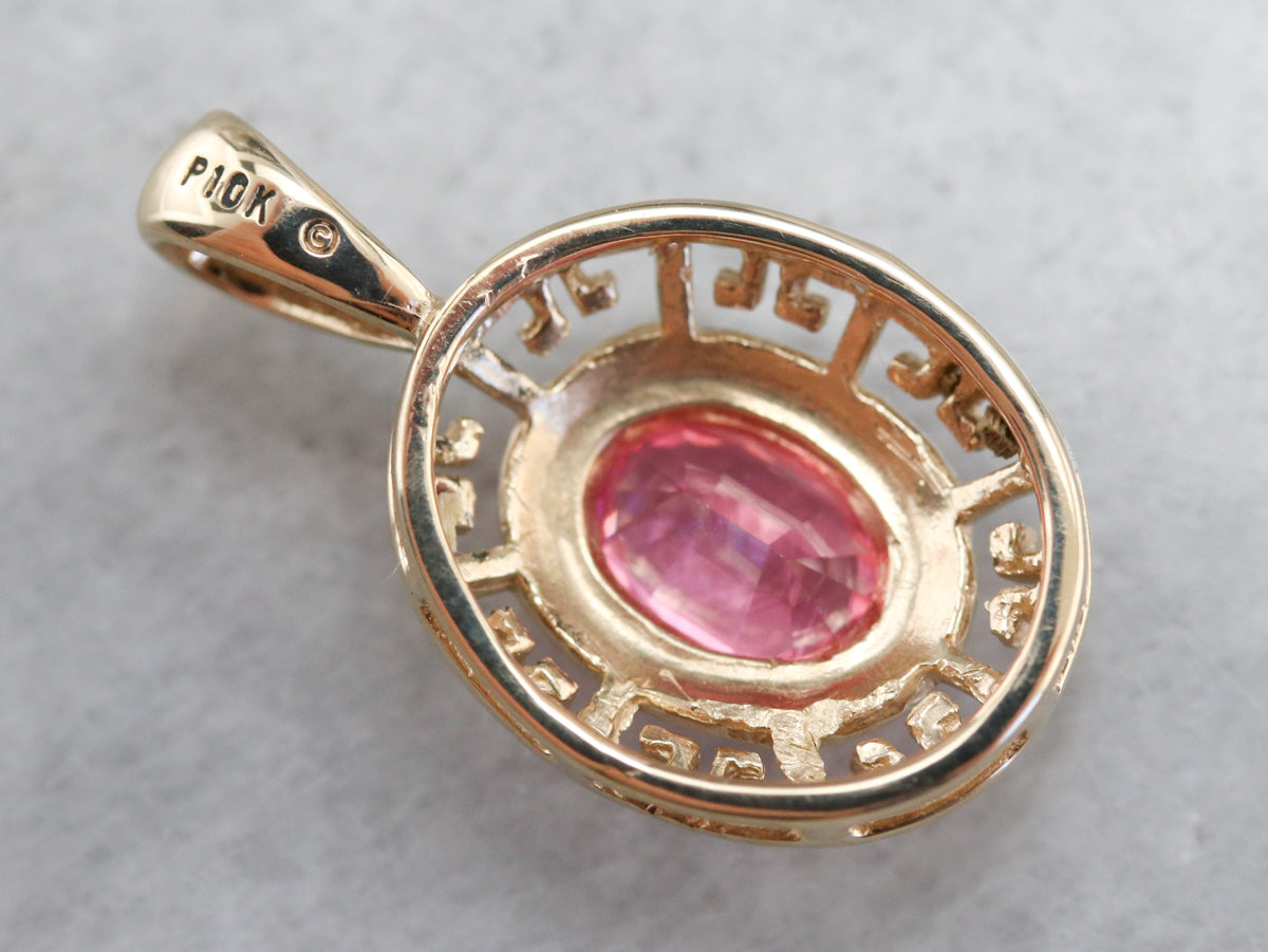 Colgante de oro perforado con zafiro rosa
