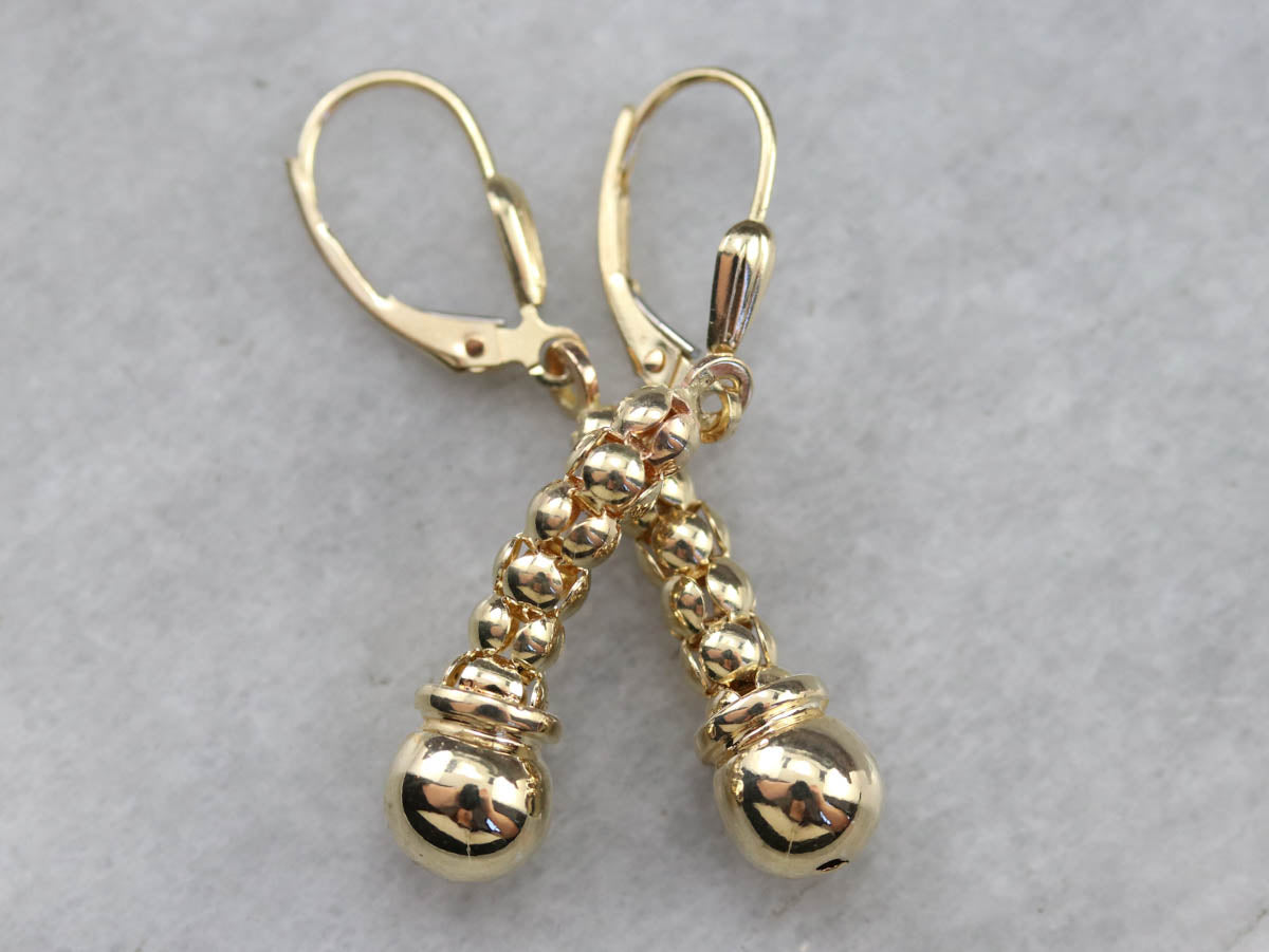 Pendientes colgantes con cuentas de oro amarillo