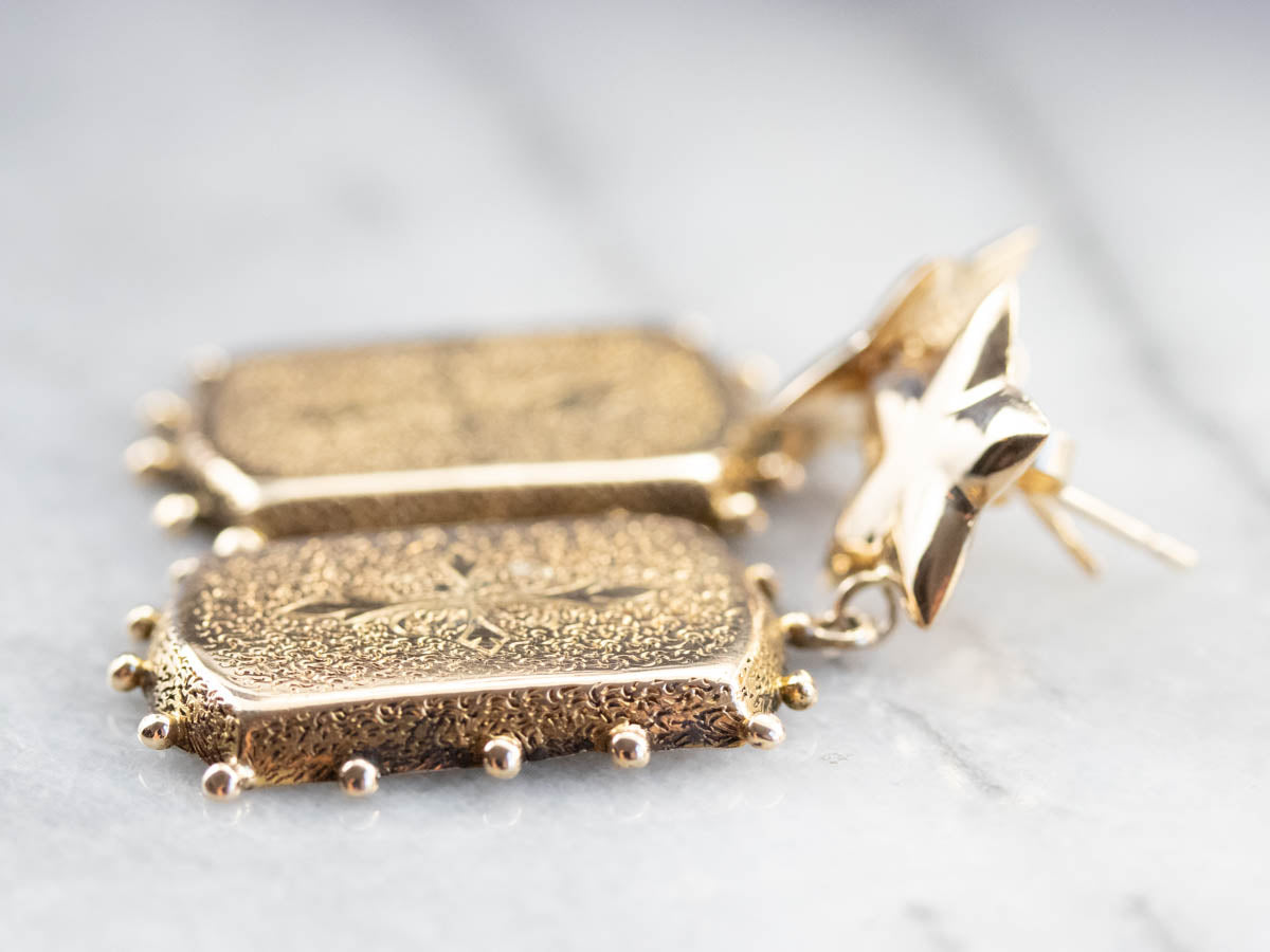 Pendientes colgantes de oro con textura adornada