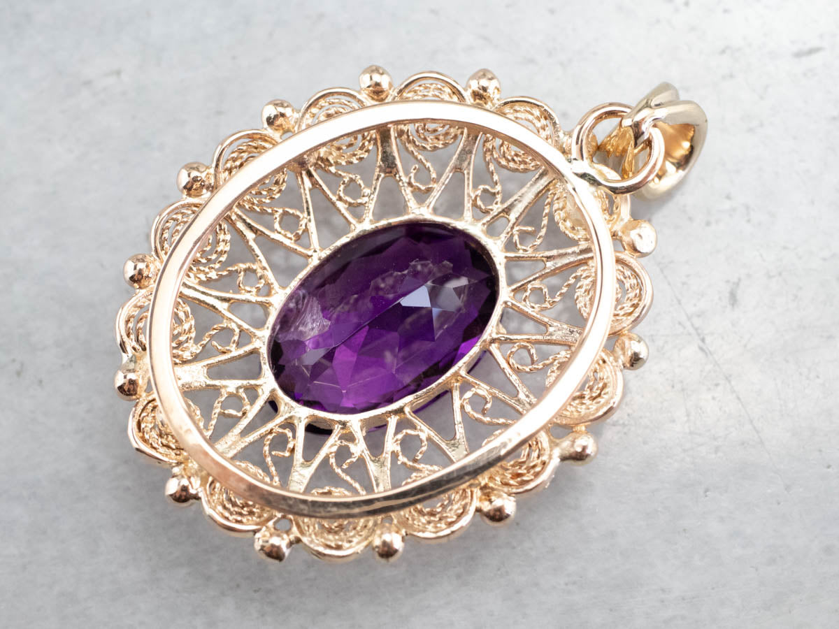 Colgante llamativo de filigrana de oro y amatista adornado