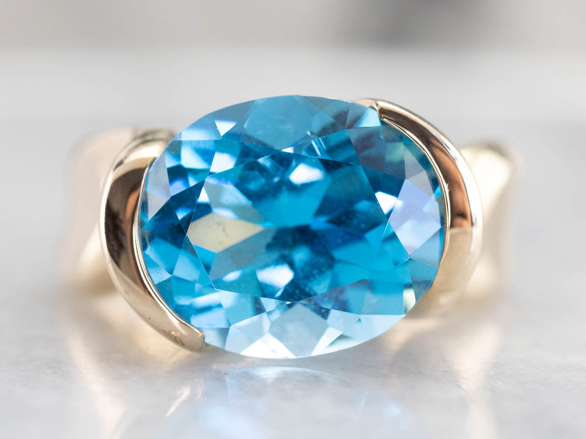 East to West Blue Topaz Modernist Gold Ring