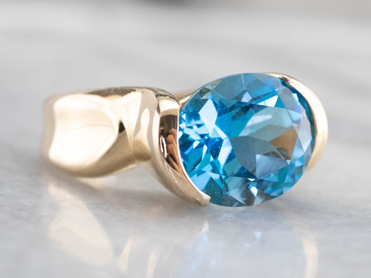 East to West Blue Topaz Modernist Gold Ring