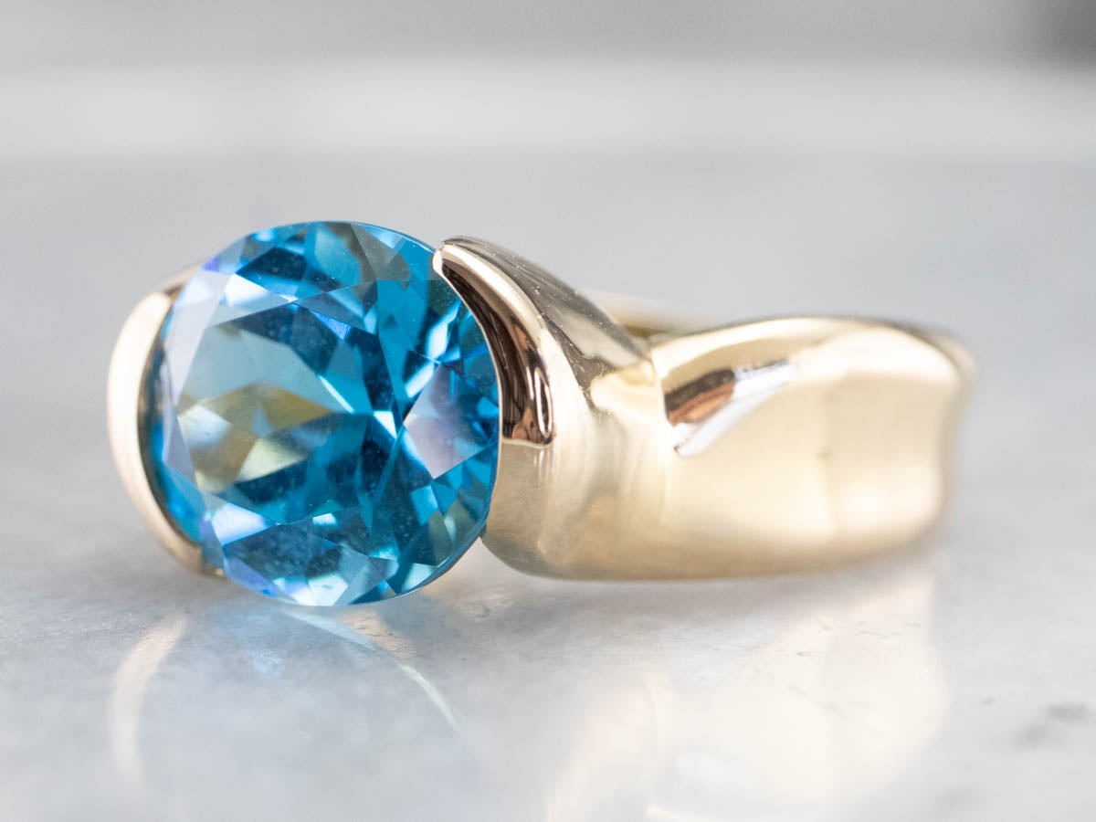 East to West Blue Topaz Modernist Gold Ring