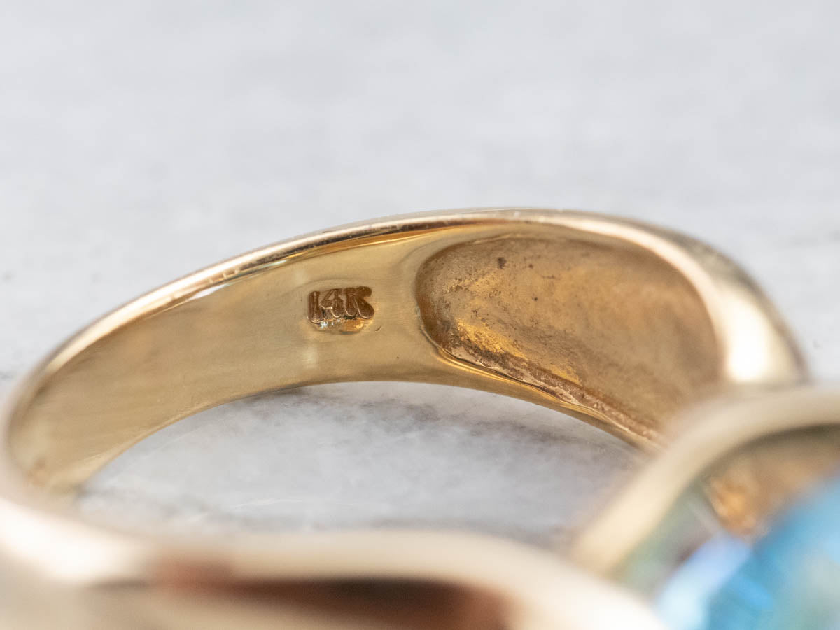 East to West Blue Topaz Modernist Gold Ring