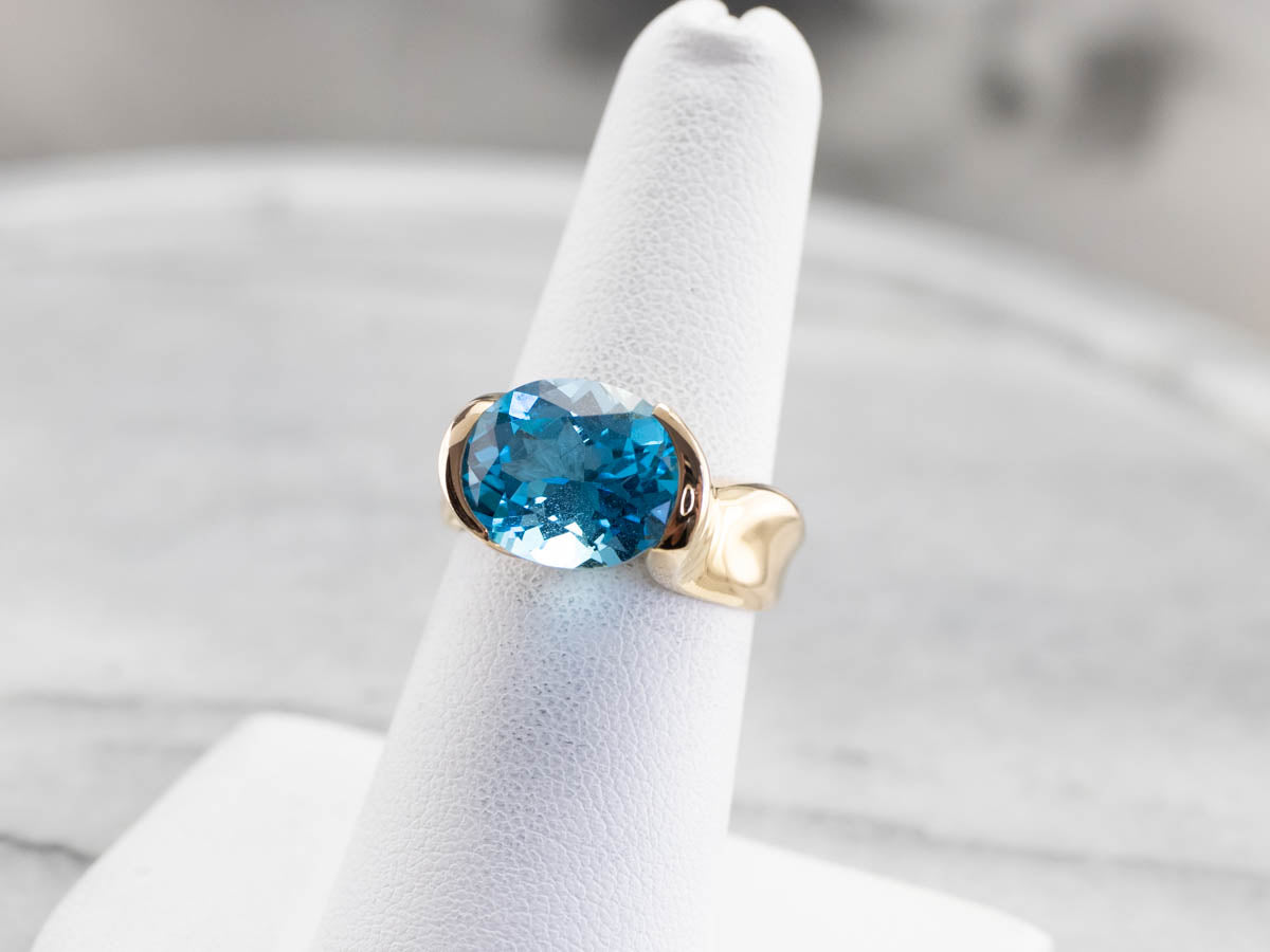 East to West Blue Topaz Modernist Gold Ring
