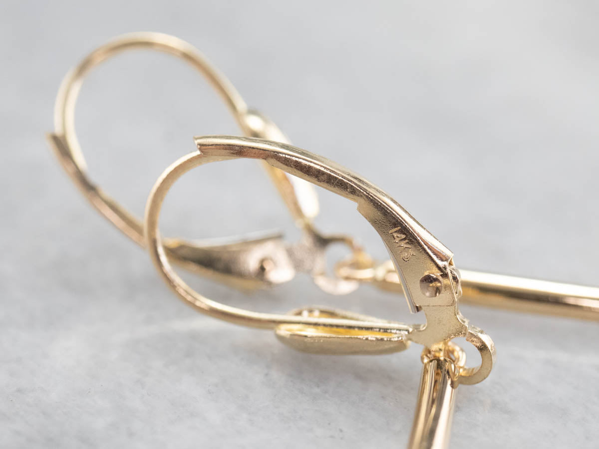 Pendientes colgantes minimalistas con barra de oro y diamantes