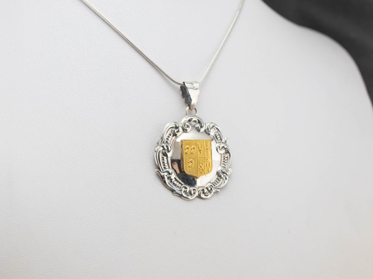 Silver and Yellow Gold Crest Pendant