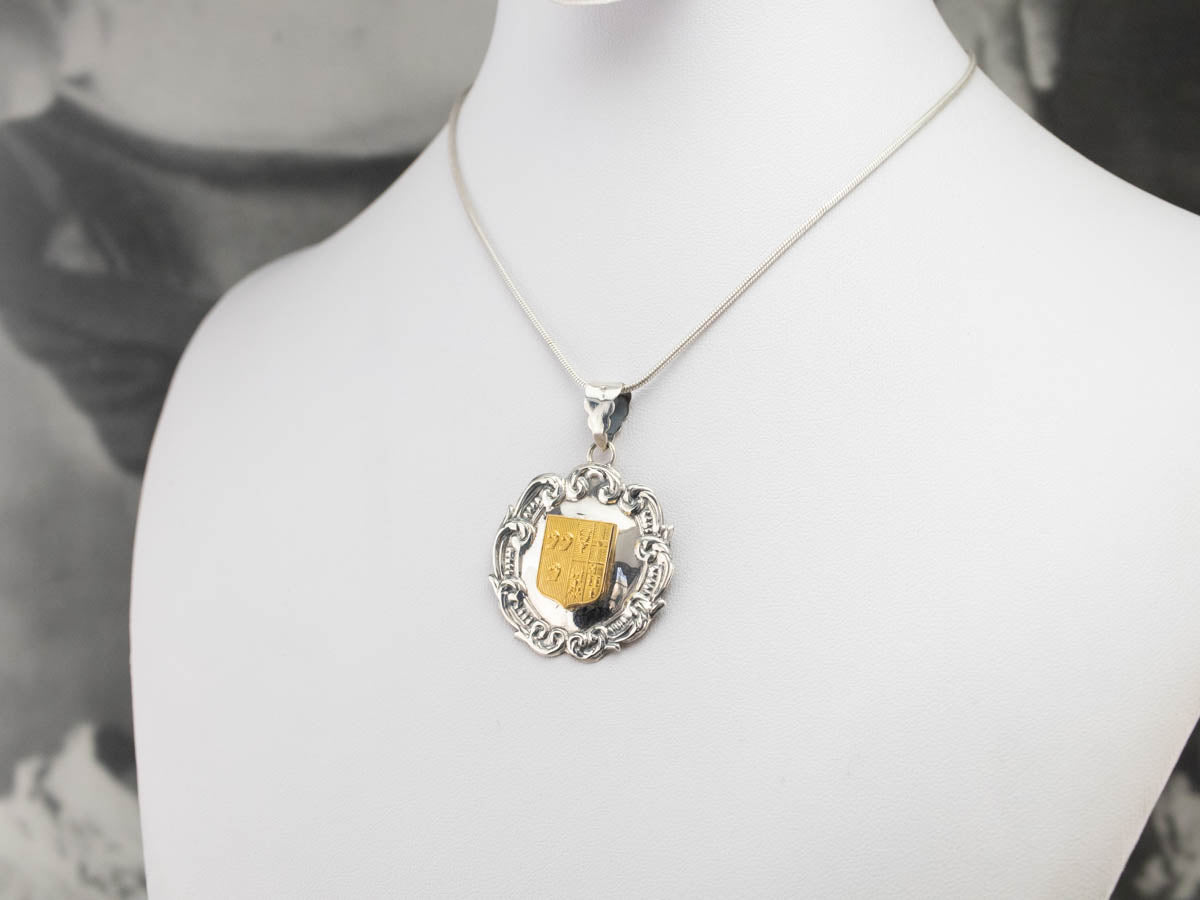 Silver and Yellow Gold Crest Pendant