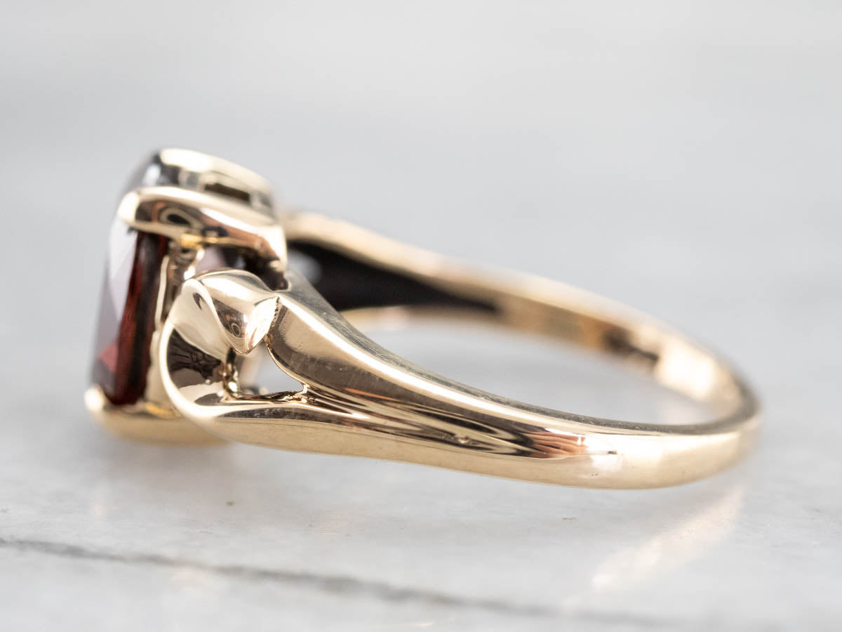 Garnet Scrolling Gold Solitaire Ring