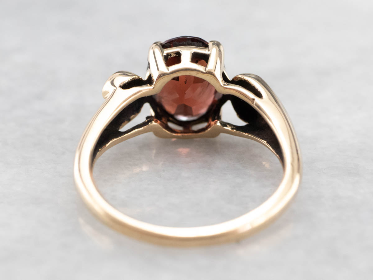 Garnet Scrolling Gold Solitaire Ring