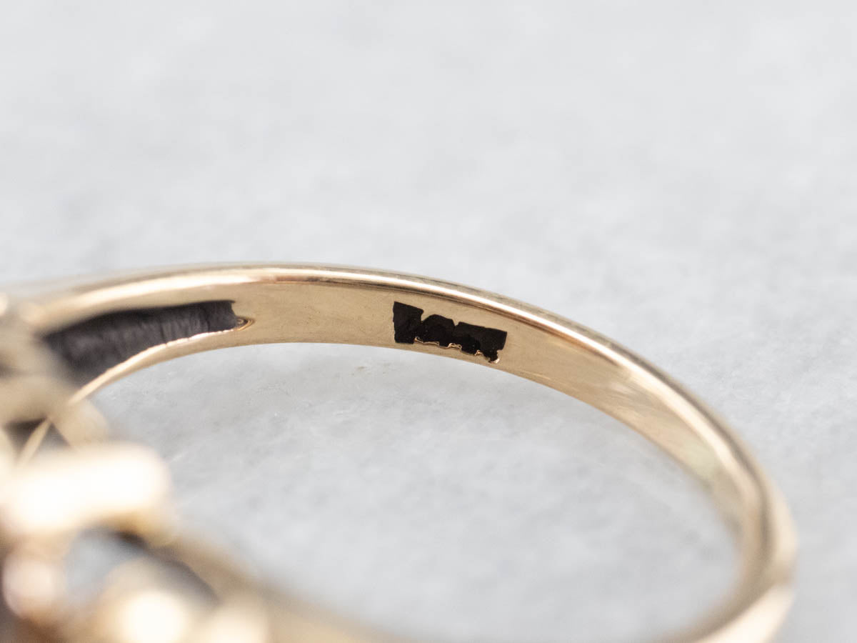 Garnet Scrolling Gold Solitaire Ring