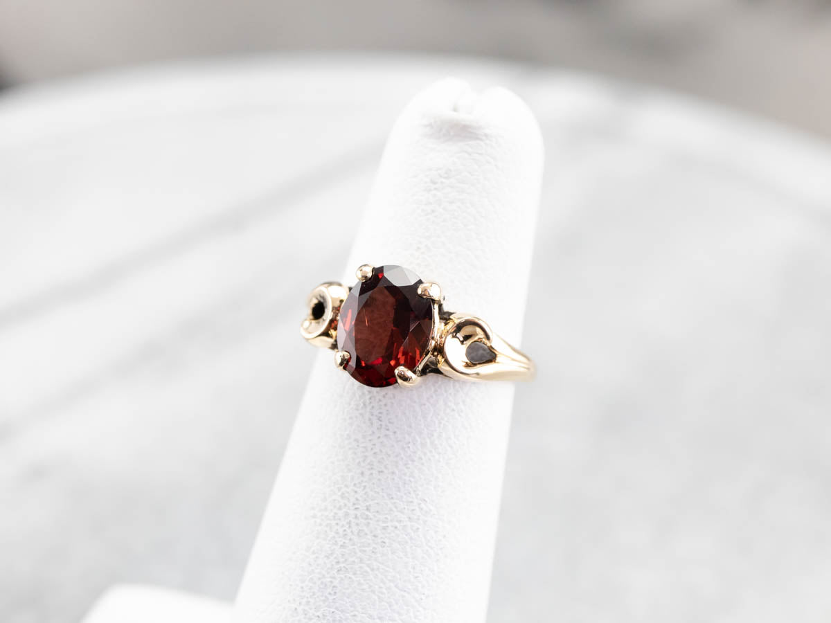 Garnet Scrolling Gold Solitaire Ring