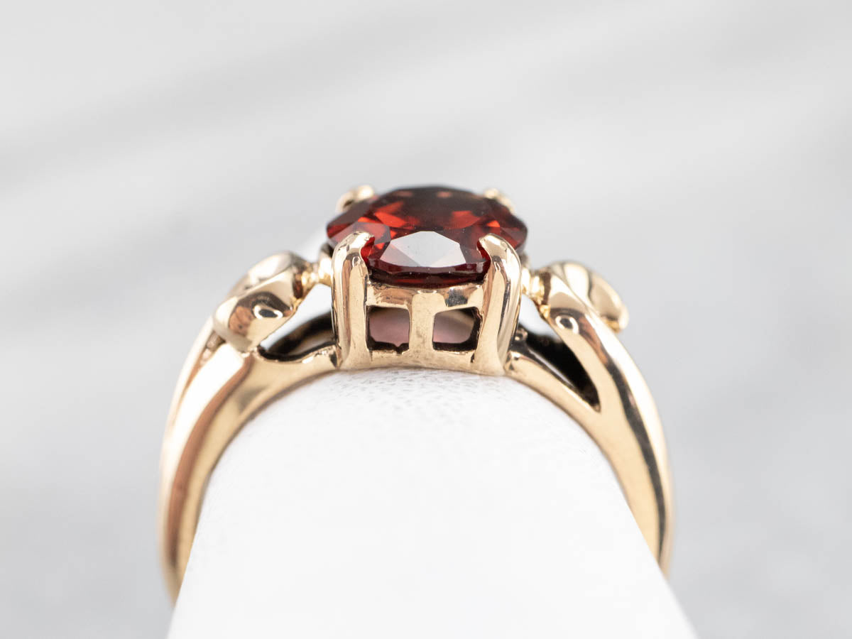 Garnet Scrolling Gold Solitaire Ring