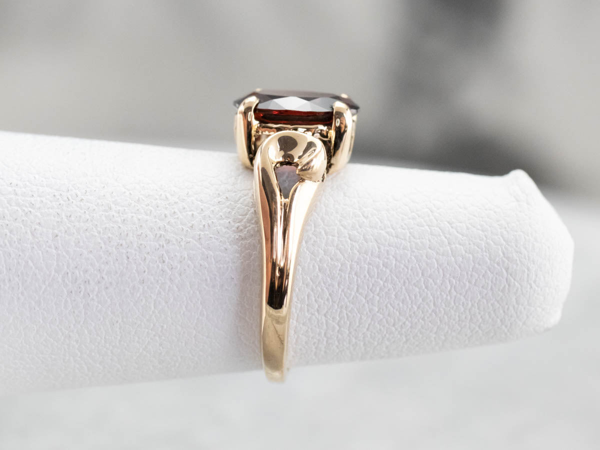 Garnet Scrolling Gold Solitaire Ring