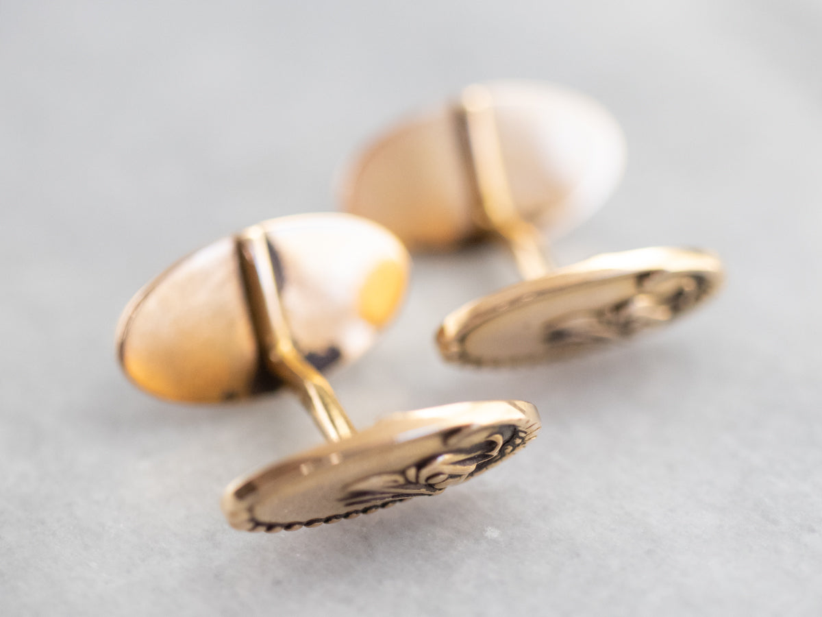 Gemelos dorados con águila de la época victoriana