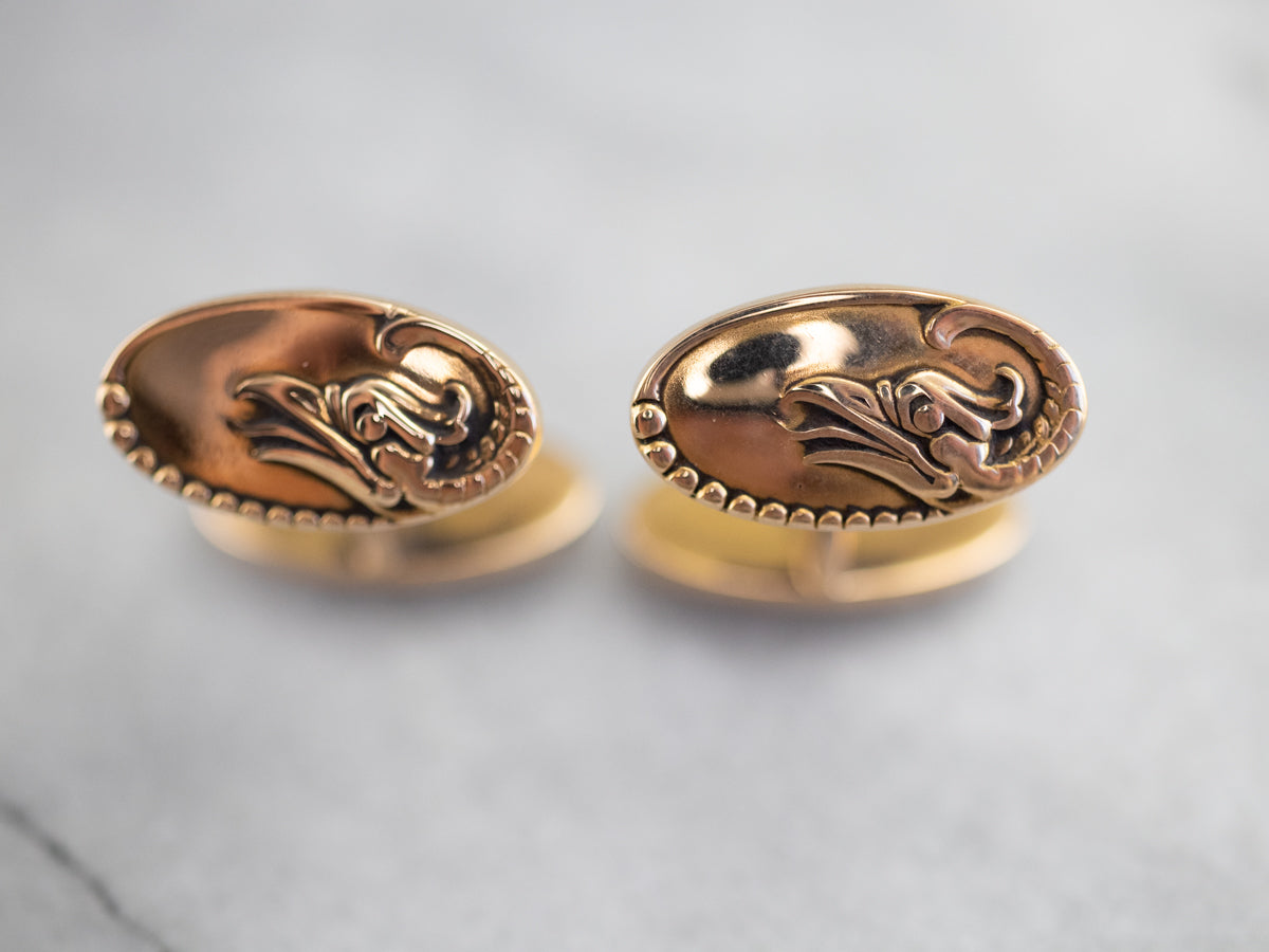 Gemelos dorados con águila de la época victoriana