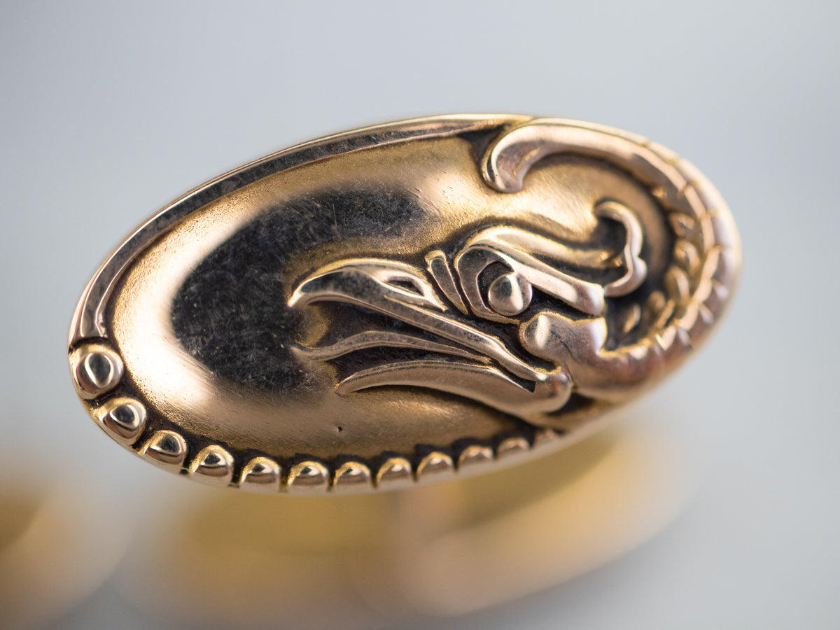 Gemelos dorados con águila de la época victoriana