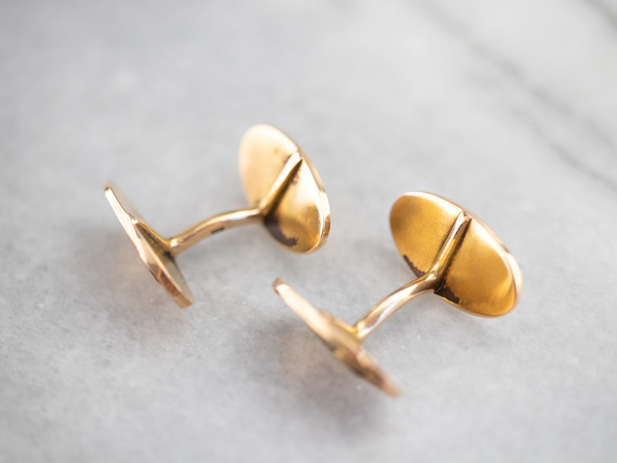 Gemelos dorados con águila de la época victoriana