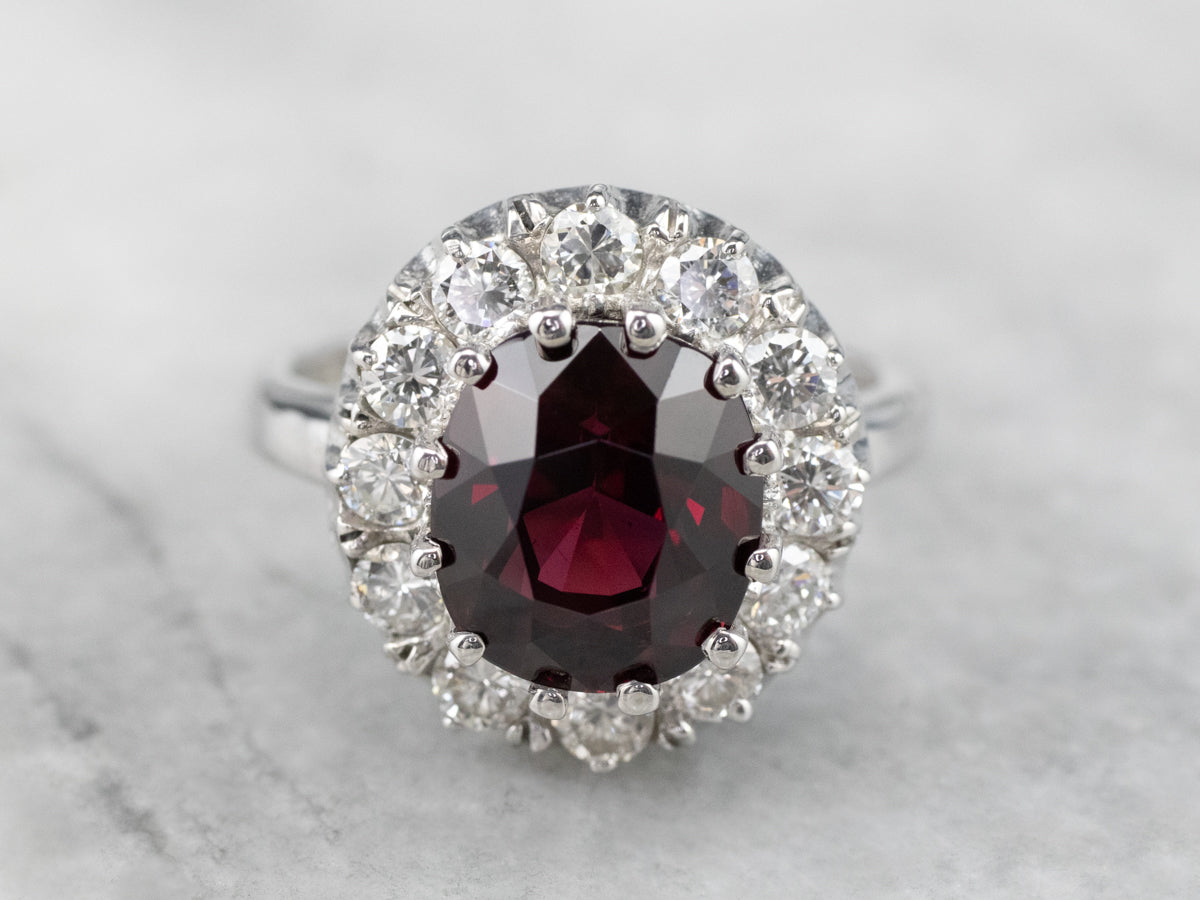 White Gold Garnet and Diamond Halo Ring