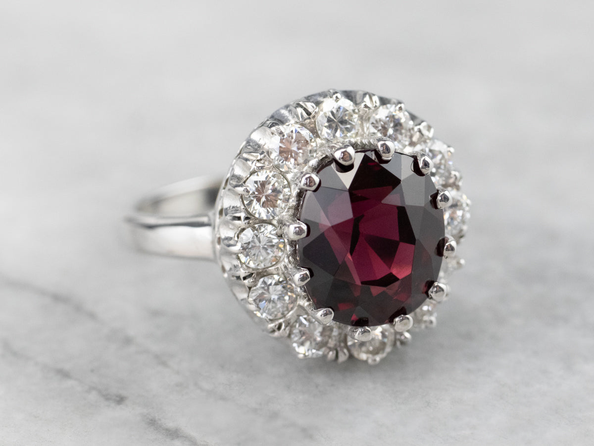 White Gold Garnet and Diamond Halo Ring