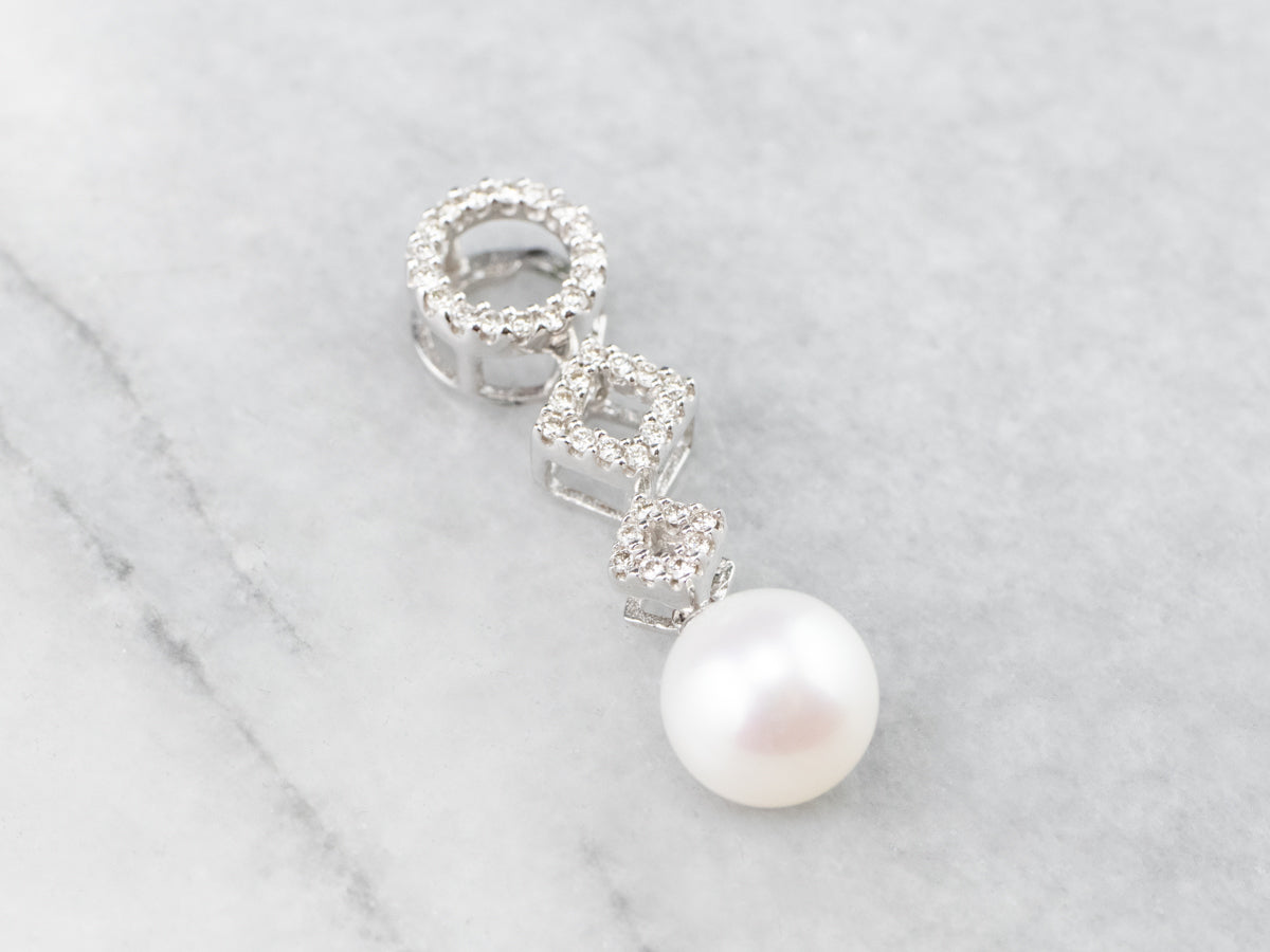 Colgante de oro blanco con diamantes y perlas geométricas