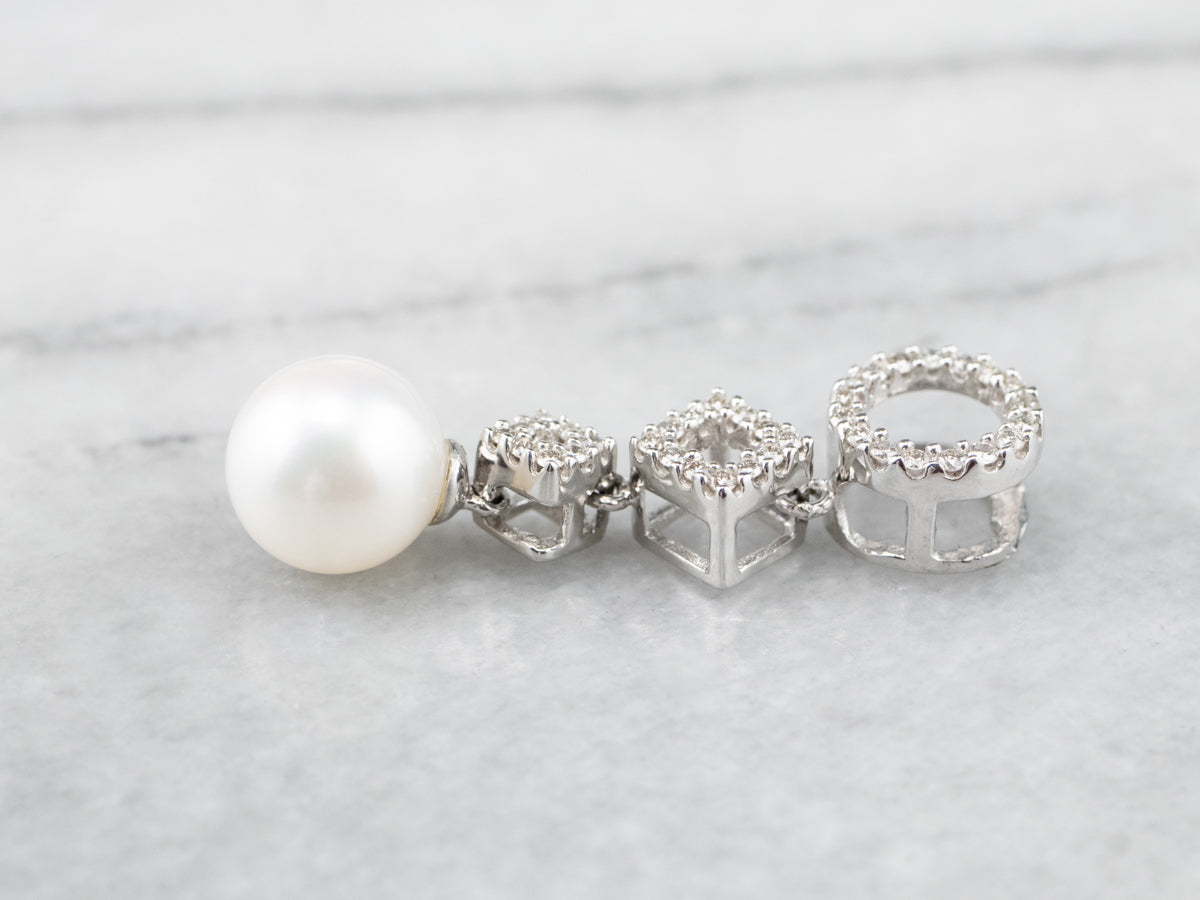 Colgante de oro blanco con diamantes y perlas geométricas