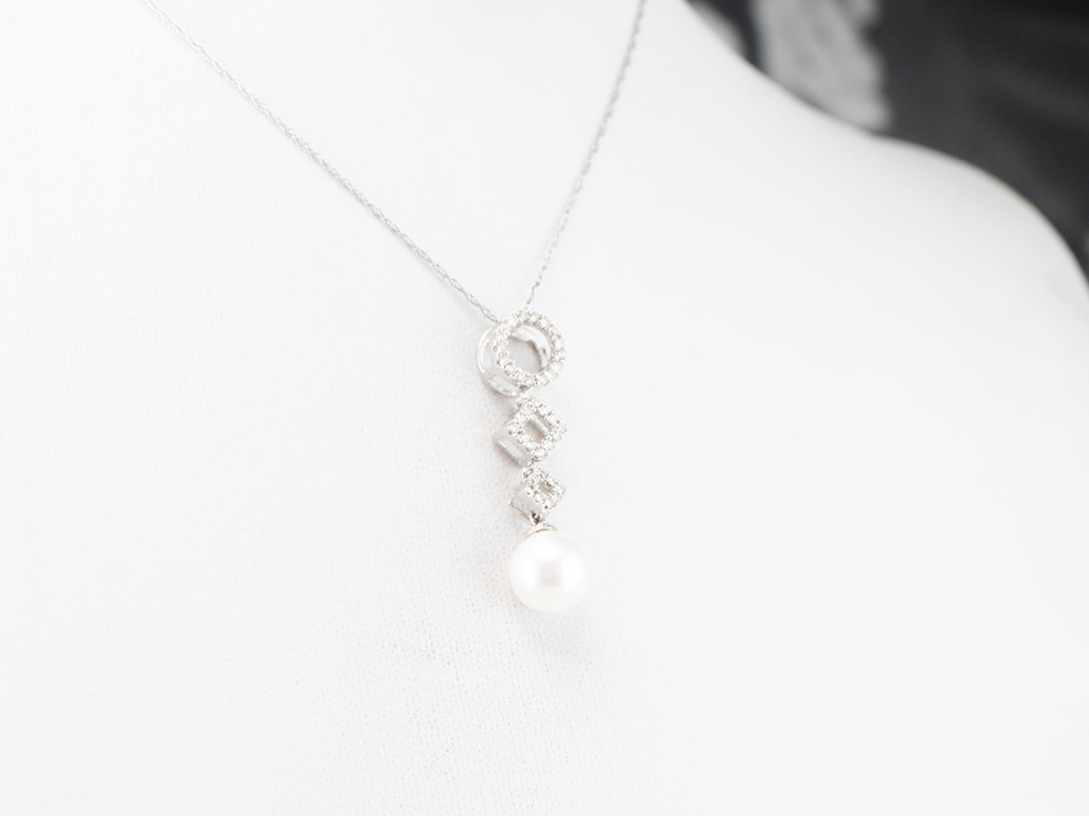 Colgante de oro blanco con diamantes y perlas geométricas