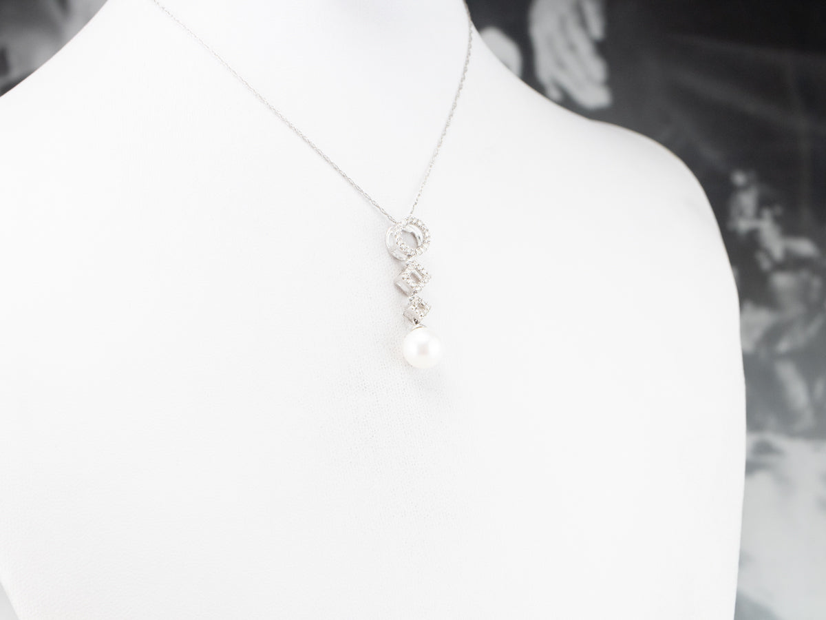 Colgante de oro blanco con diamantes y perlas geométricas