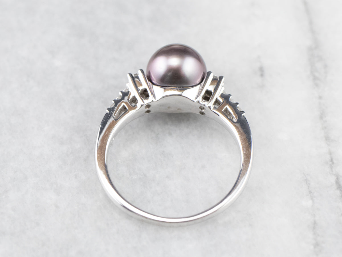 Anillo de perlas negras y diamantes