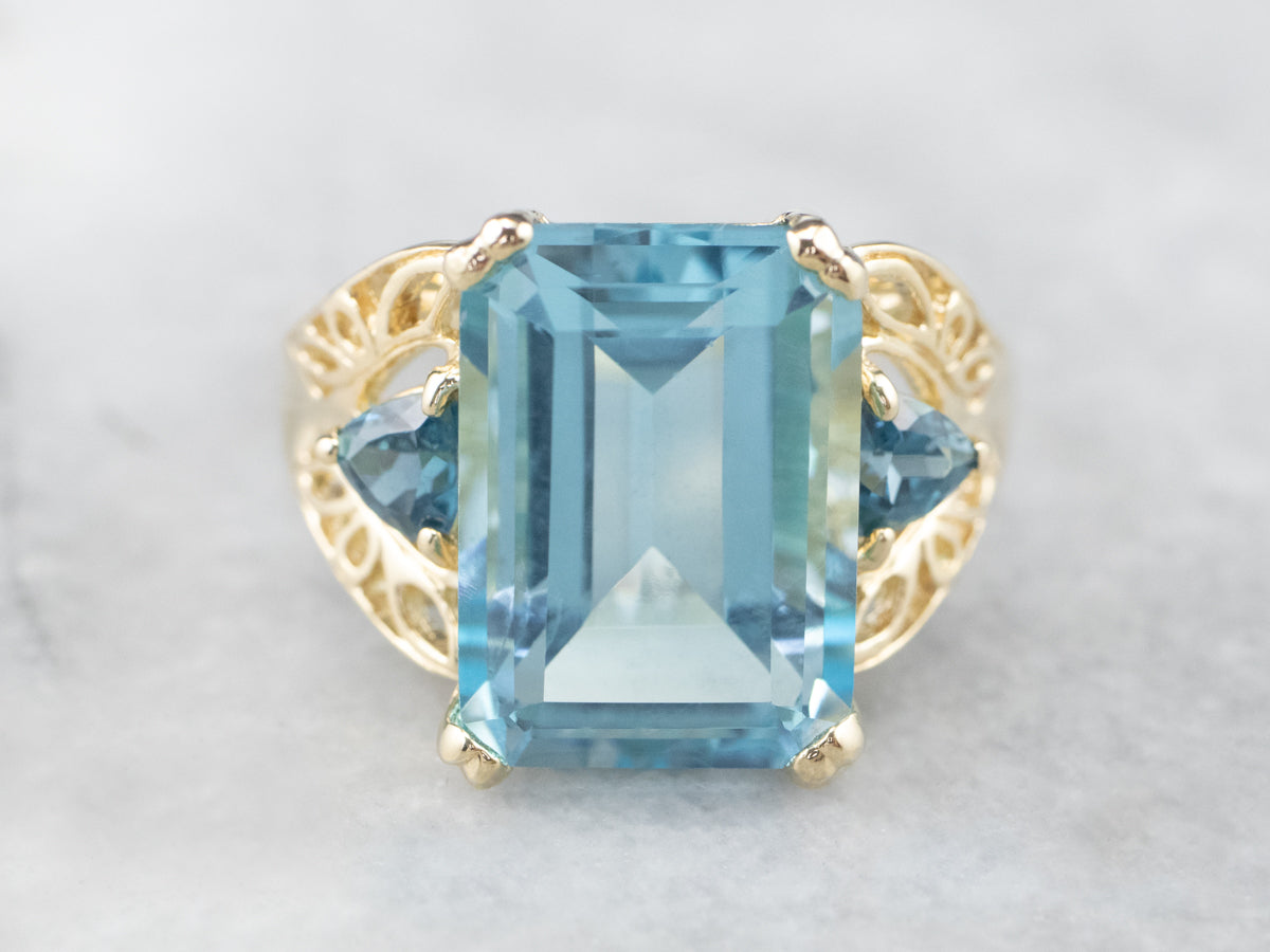 Three Stone Blue Topaz Gold Cocktail Ring