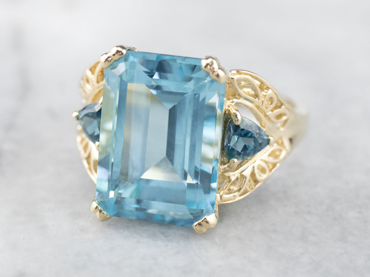 Three Stone Blue Topaz Gold Cocktail Ring
