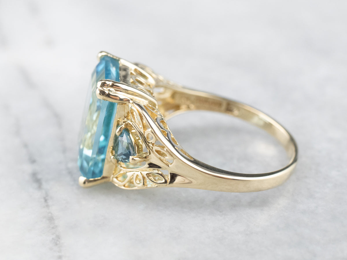Three Stone Blue Topaz Gold Cocktail Ring