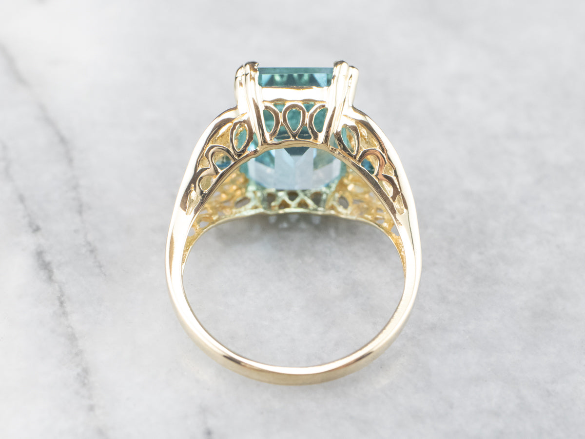 Three Stone Blue Topaz Gold Cocktail Ring