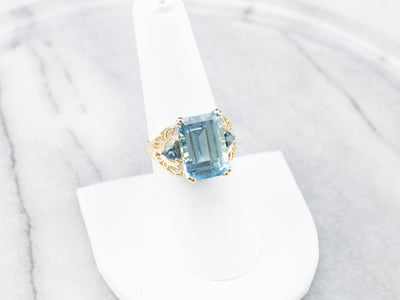 Three Stone Blue Topaz Gold Cocktail Ring