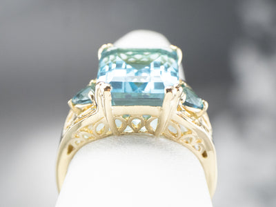 Three Stone Blue Topaz Gold Cocktail Ring