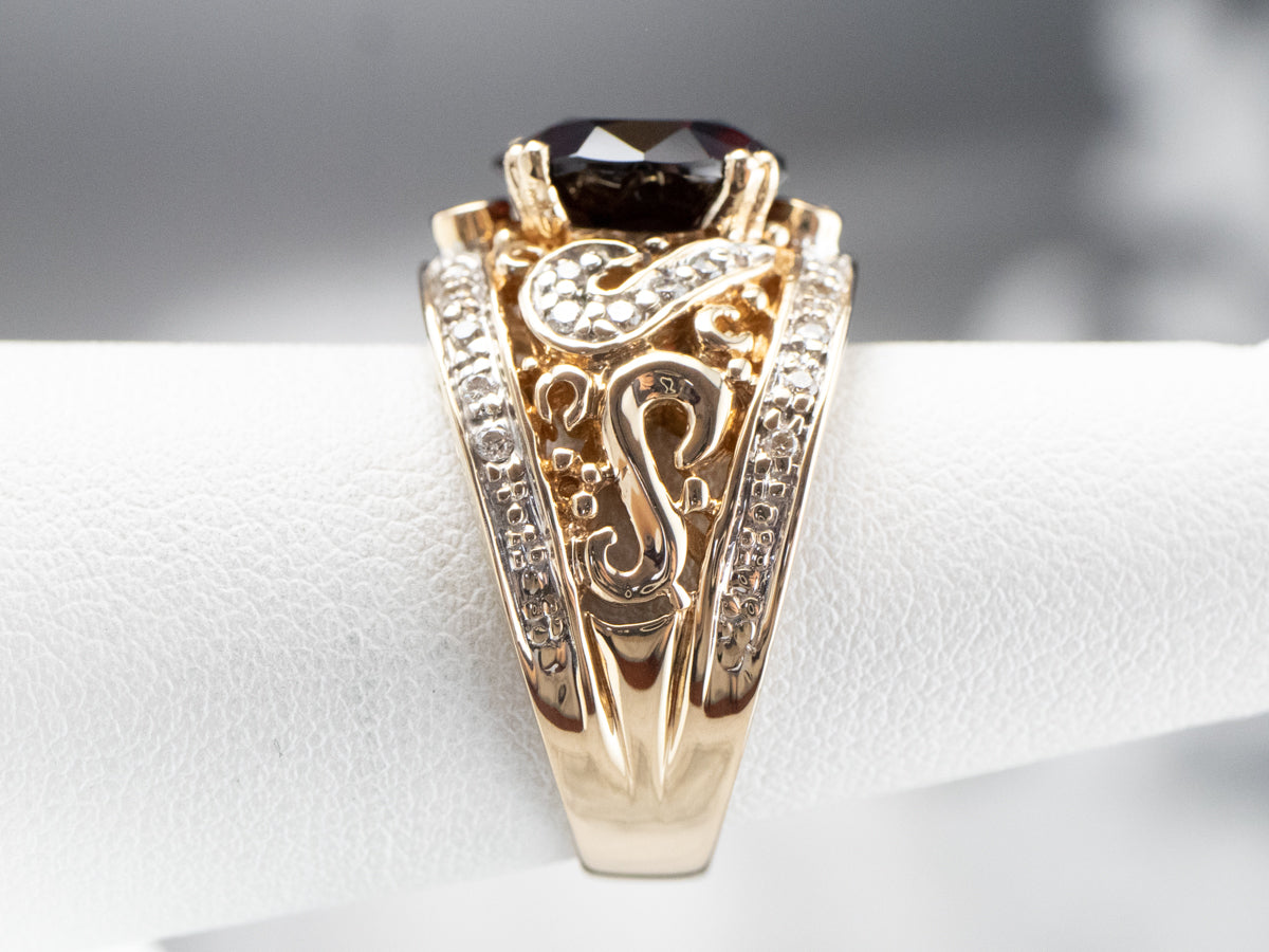 Anillo de oro bicolor con diamantes y granate piropo