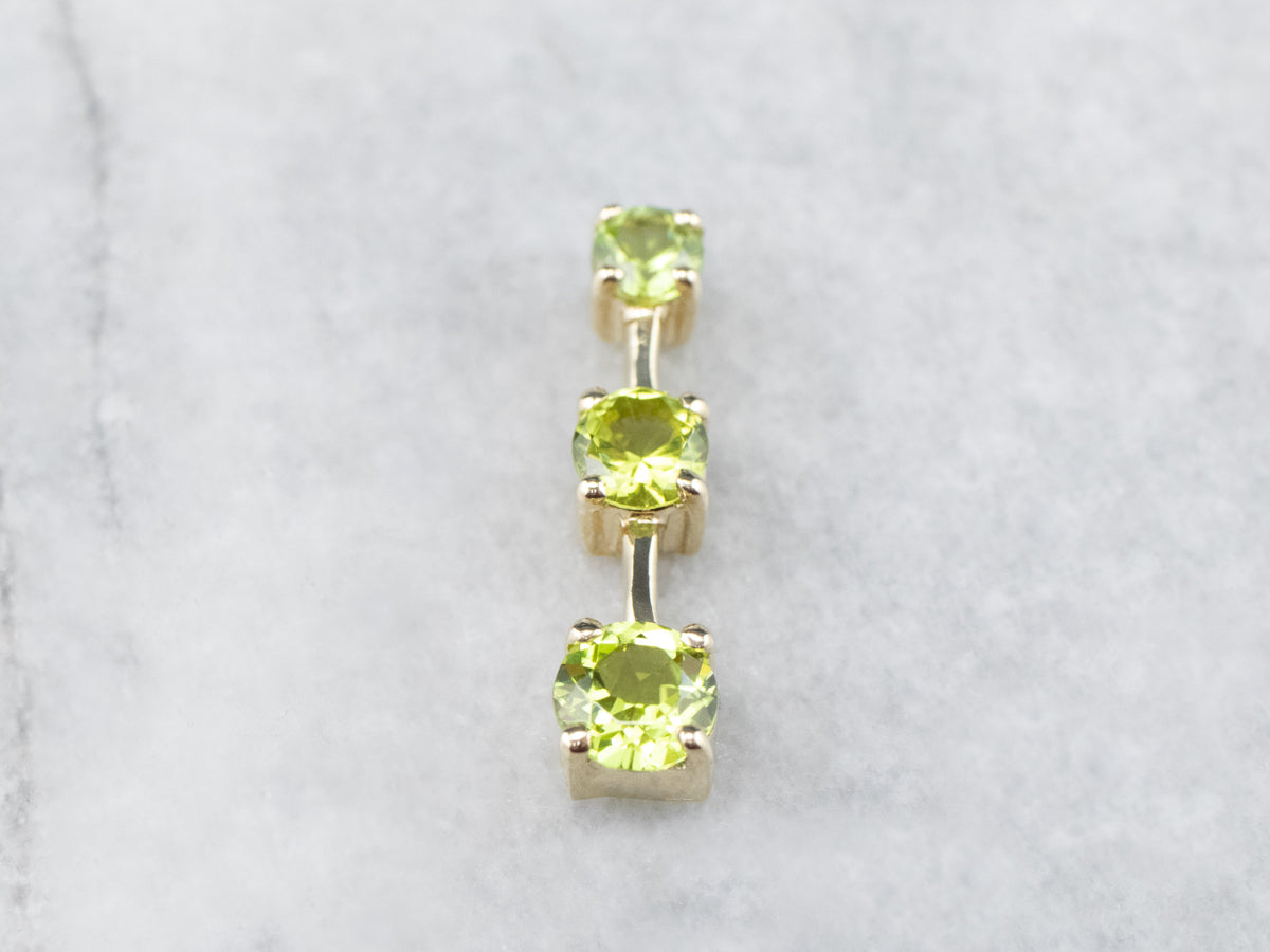 Graduated Three Stone Peridot Gold Pendant